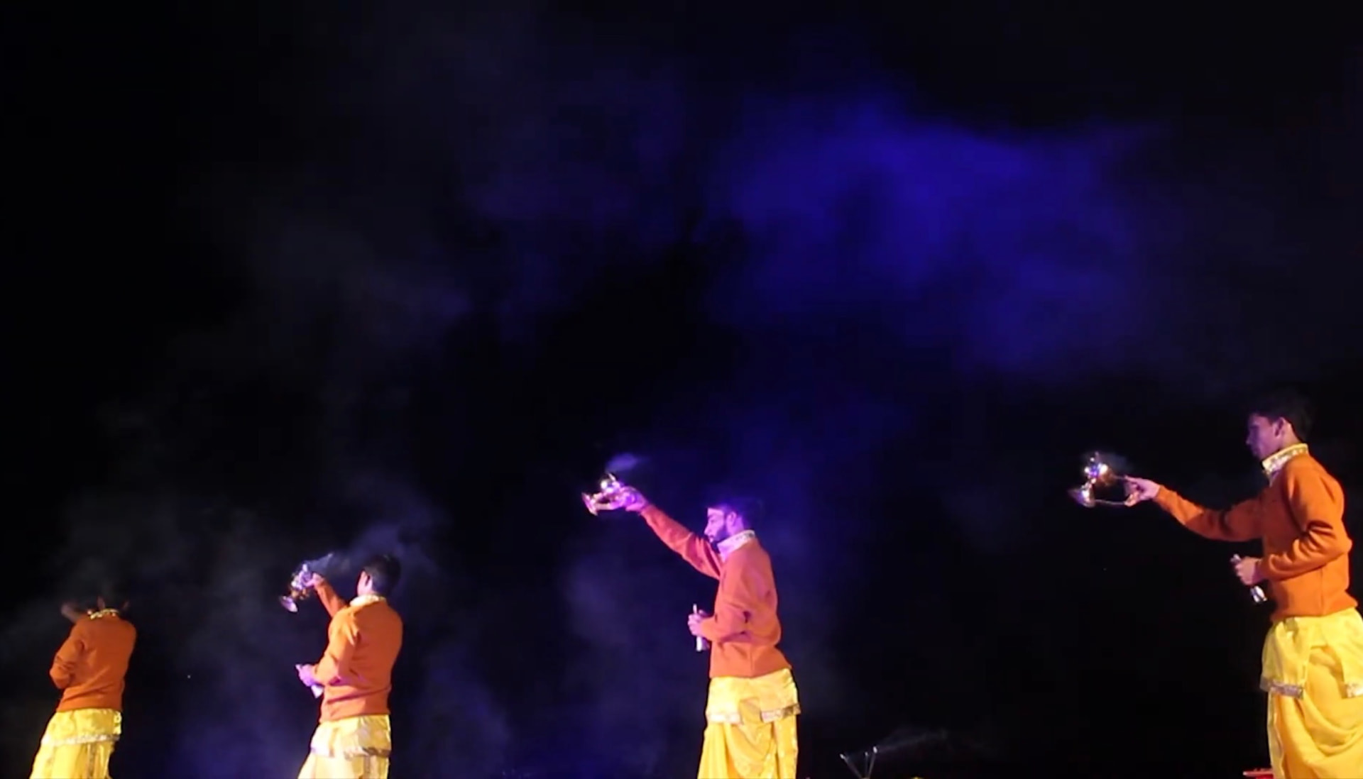 Ganga aarti dancers in saffron